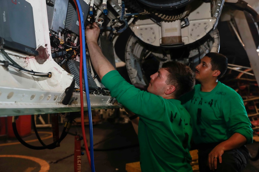 Abraham Lincoln Sailors conduct aircraft maintenance