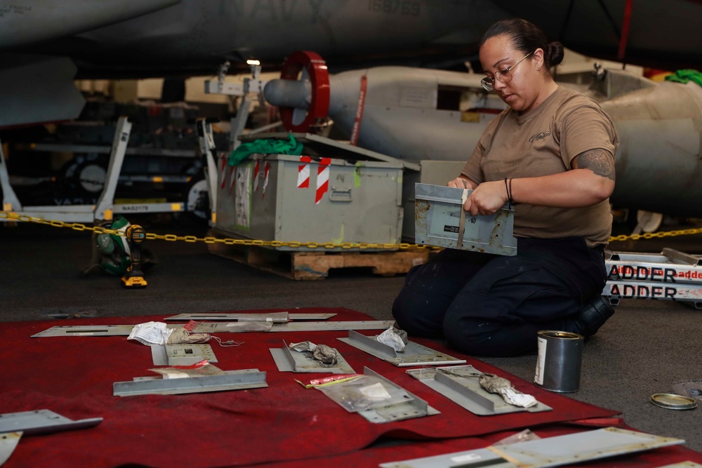 Abraham Lincoln Sailors conduct aircraft maintenance