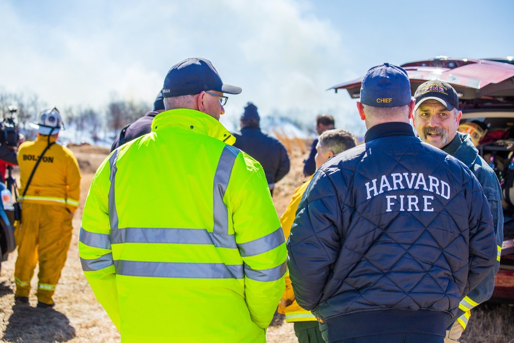 Fire Chiefs from different cities discussing the next course of action in containing the fire.