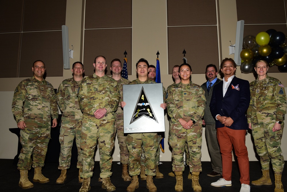 Del 4 poses for a group photo