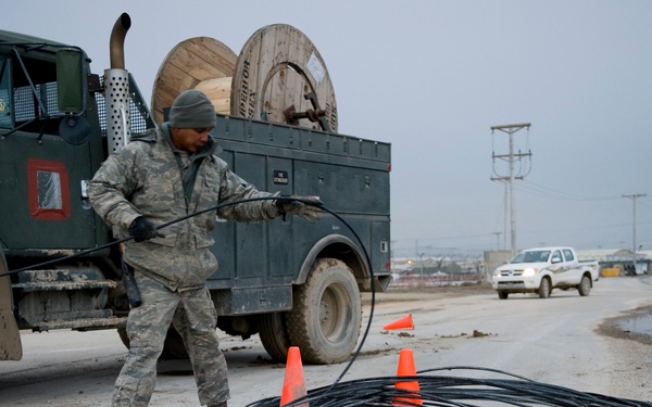 Personnel from the 212th Air National Guard, Milford, MA., 202nd Engineering and Installation Squadron (EIS), Macon, GA, 285th EIS, Biloxi, MS and the 215 EIS, Everett, WA. join forces at Bagram Airfield, Afghanistan to install fiber optic cable