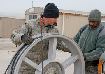 Personnel from the 212th Air National Guard, Milford, MA., 202nd Engineering and Installation Squadron (EIS), Macon, GA, 285th EIS, Biloxi, MS and the 215 EIS, Everett, WA. join forces at Bagram Airfield, Afghanistan to install fiber optic cable
