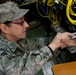 MSgt Lyn Fry prepares an equipment rack for fiber optic cable installation at Bagram Air Field in Afghanistan