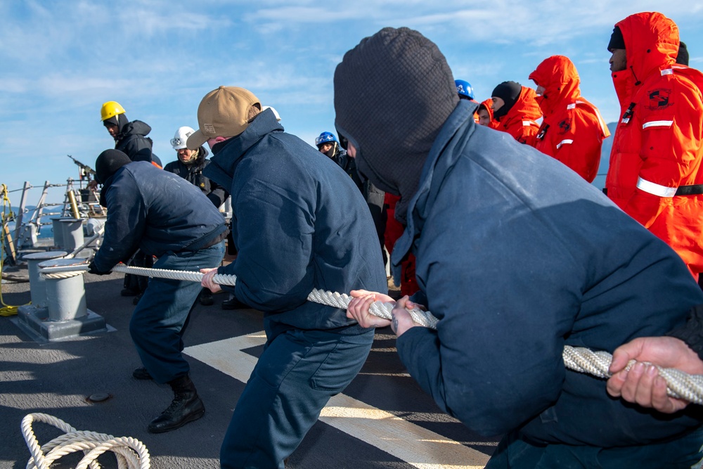 Sailors aboard Arleigh Burke-class guided-missile destroyer USS Mitscher (DDG 57) practice line handling while entering port in Aksaz, Turkey