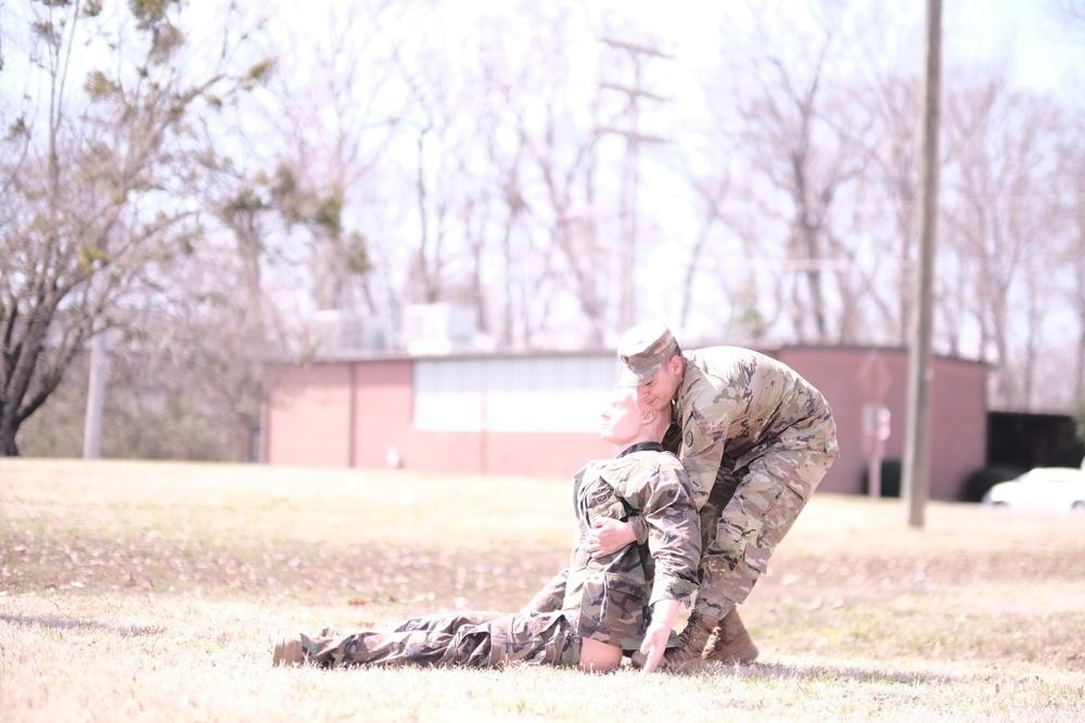 Soldiers evaluate a casualty during Soldier of the Quarter competition