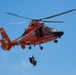 Coast Guard K-9s and their handlers perform K-9 hoisting operations