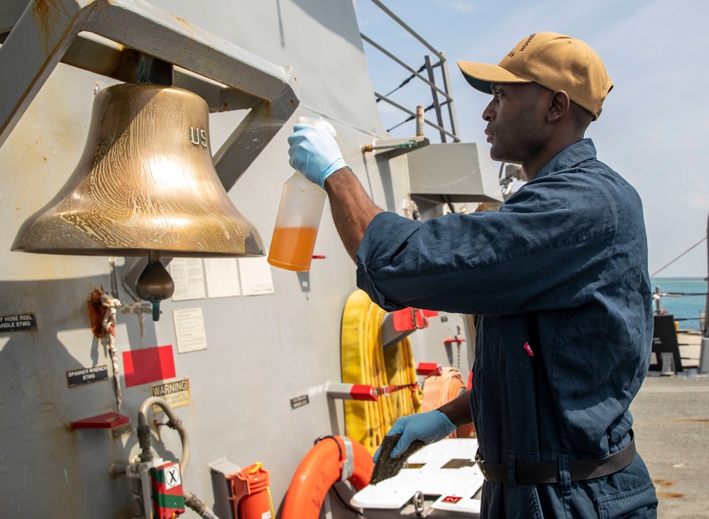 A Sailor Conducts Maintenance Aboard USS Ralph Johnson (DDG 114)