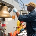 A Sailor Conducts Maintenance Aboard USS Ralph Johnson (DDG 114)