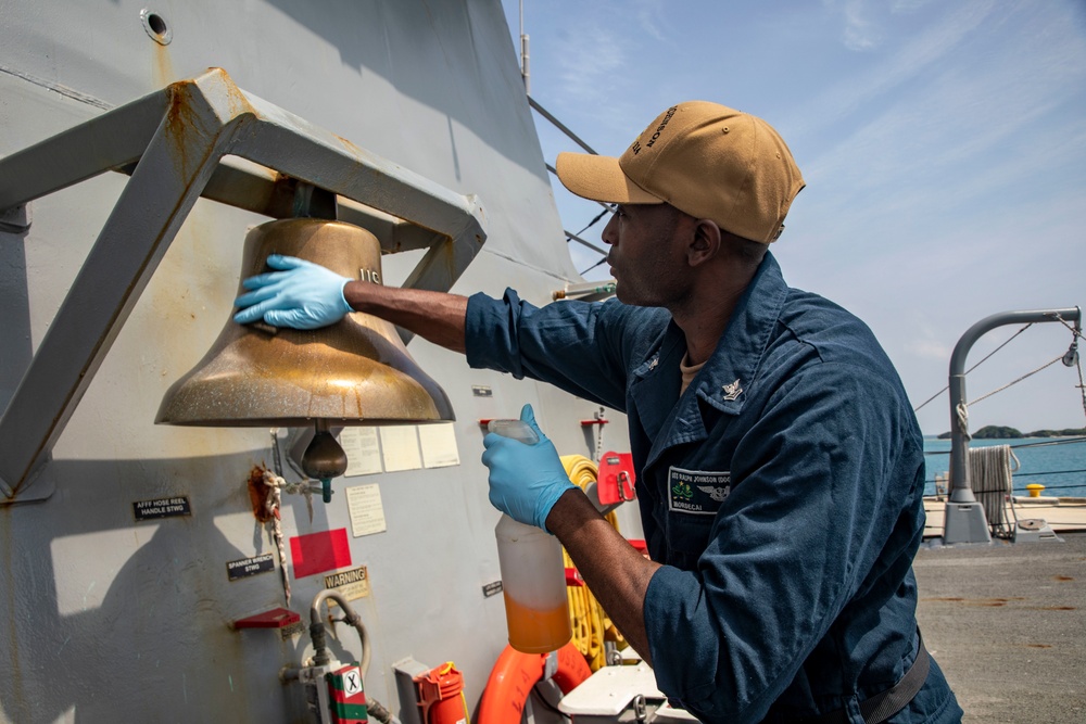 A Sailor Conducts Maintenance Aboard USS Ralph Johnson (DDG 114)