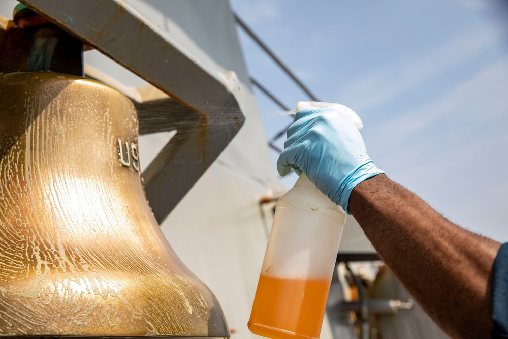 A Sailor Conducts Maintenance Aboard USS Ralph Johnson (DDG 114)