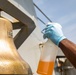 A Sailor Conducts Maintenance Aboard USS Ralph Johnson (DDG 114)