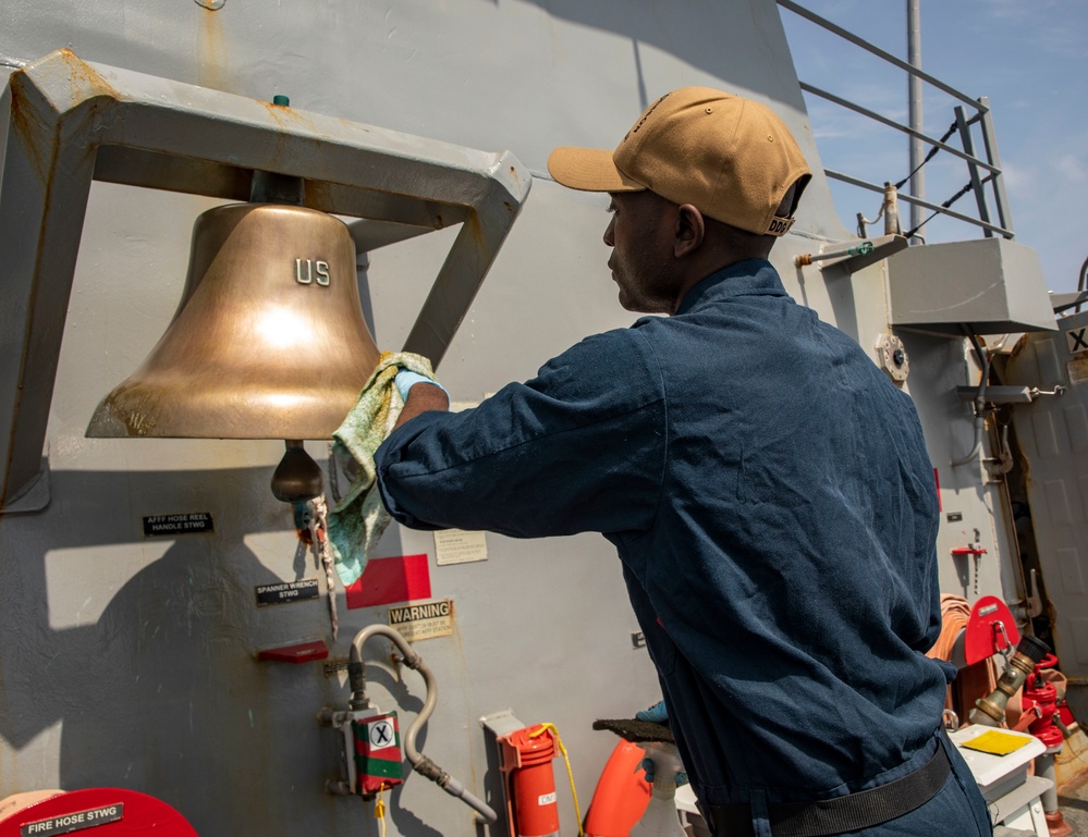 A Sailor Conducts Maintenance Aboard USS Ralph Johnson (DDG 114)