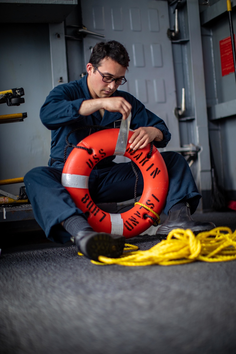 Makin Island Sailor Maintains Survival Equipment