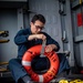 Makin Island Sailor Maintains Survival Equipment