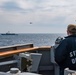 Ensign Jameson Brown-Padien, from Block Island, R.I., aboard USS Mitscher (DDG 57) watches as Turkish Navy Oliver Hazard Perry-class frigate TCG Giresun (F 491) conducts flight operations