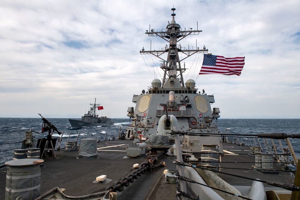 Arleigh Burke-class guided-missile destroyer USS Mitscher (DDG 57) conducts a passing exercise with Turkish Navy Oliver Hazard Perry-class frigate TCG Giresun (F 491)