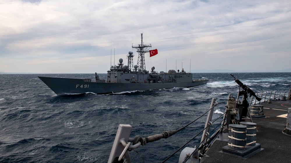 Arleigh Burke-class guided-missile destroyer USS Mitscher (DDG 57) conducts a passing exercise with Turkish Navy Oliver Hazard Perry-class frigate TCG Giresun (F 491)