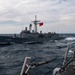 Arleigh Burke-class guided-missile destroyer USS Mitscher (DDG 57) conducts a passing exercise with Turkish Navy Oliver Hazard Perry-class frigate TCG Giresun (F 491)