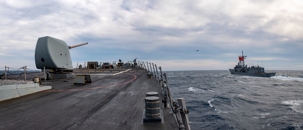 Arleigh Burke-class guided-missile destroyer USS Mitscher (DDG 57) conducts a passing exercise with Turkish Navy Oliver Hazard Perry-class frigate TCG Giresun (F 491)