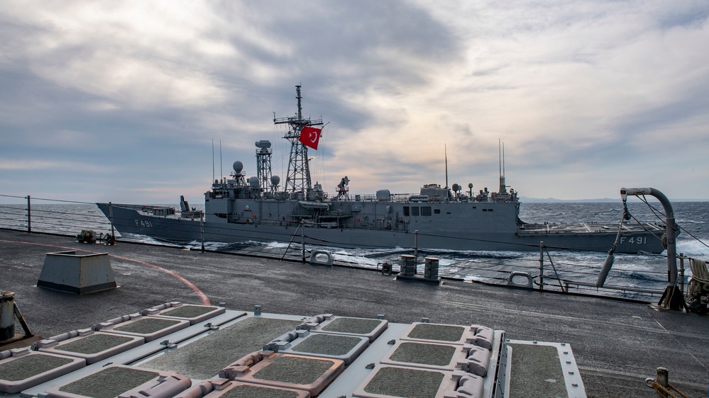 Arleigh Burke-class guided-missile destroyer USS Mitscher (DDG 57) conducts a passing exercise with Turkish Navy Oliver Hazard Perry-class frigate TCG Giresun (F 491)