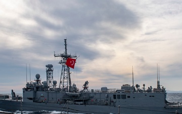 Arleigh Burke-class guided-missile destroyer USS Mitscher (DDG 57) conducts a passing exercise with Turkish Navy Oliver Hazard Perry-class frigate TCG Giresun (F 491)