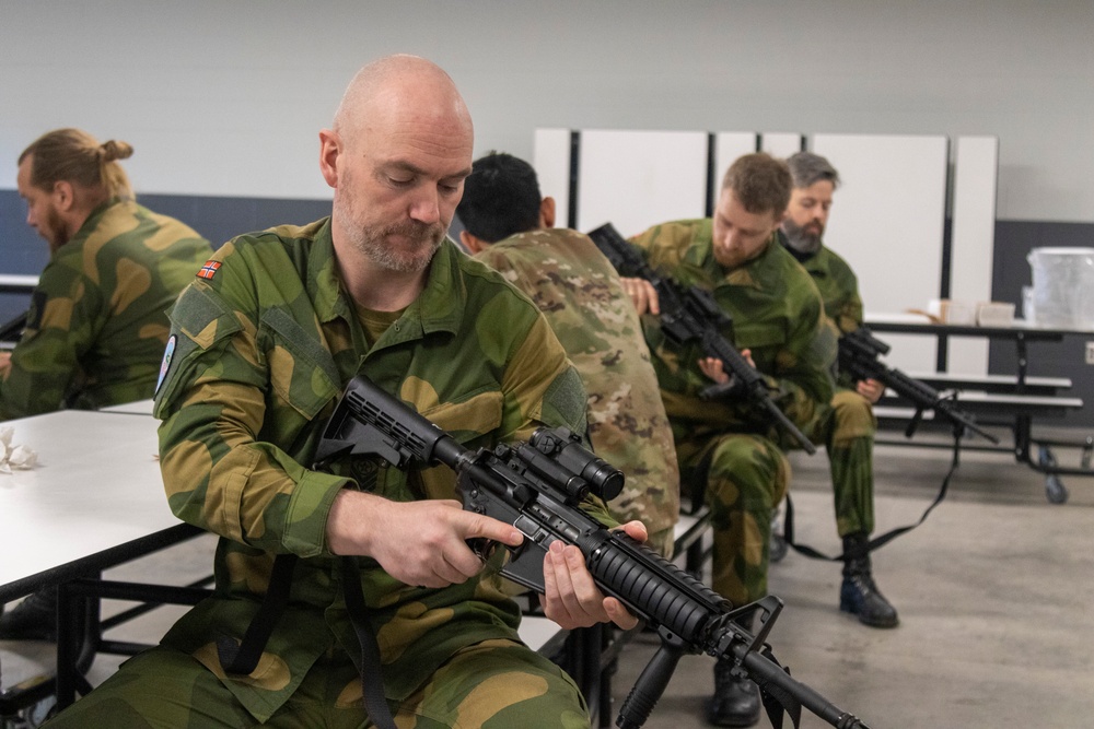 Norwegian Soldiers prepare for weapons qualification at Camp Ripley