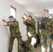 Norwegian Soldiers prepare for weapons qualification at Camp Ripley