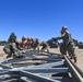 US Navy Seabees with Naval Mobile Construction Battalion 5 build a Mabey Johnson Bridge