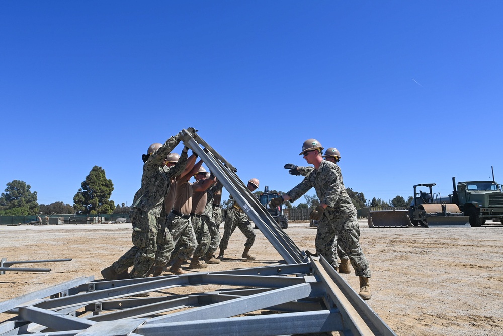 US Navy Seabees with Naval Mobile Construction Battalion 5 build a Mabey Johnson Bridge