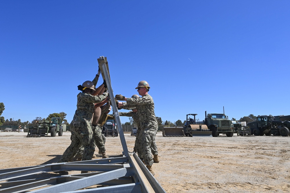 US Navy Seabees with Naval Mobile Construction Battalion 5 build a Mabey Johnson Bridge