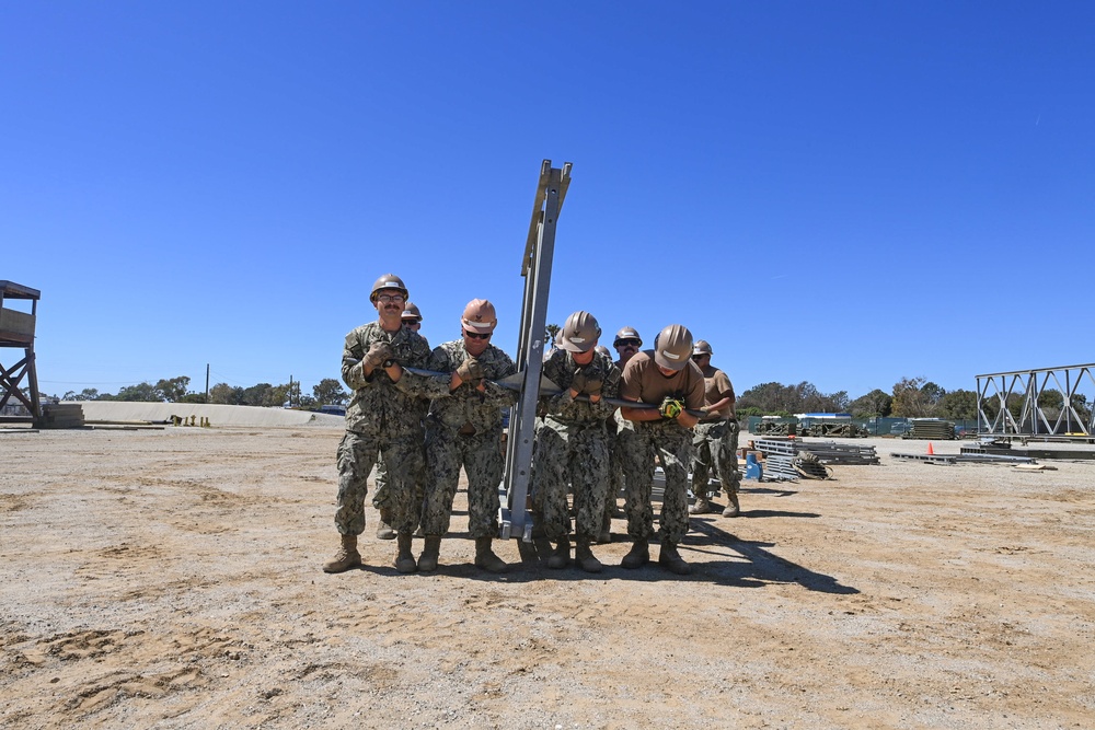 US Navy Seabees with Naval Mobile Construction Battalion 5 build a Mabey Johnson Bridge