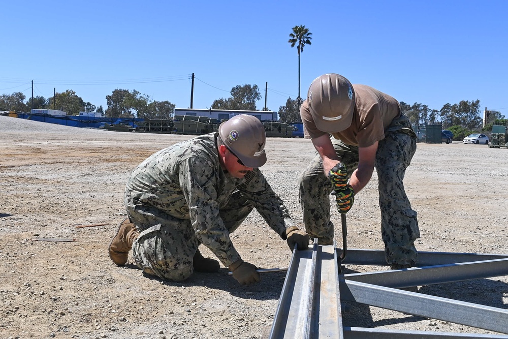 US Navy Seabees with Naval Mobile Construction Battalion 5 build a Mabey Johnson Bridge