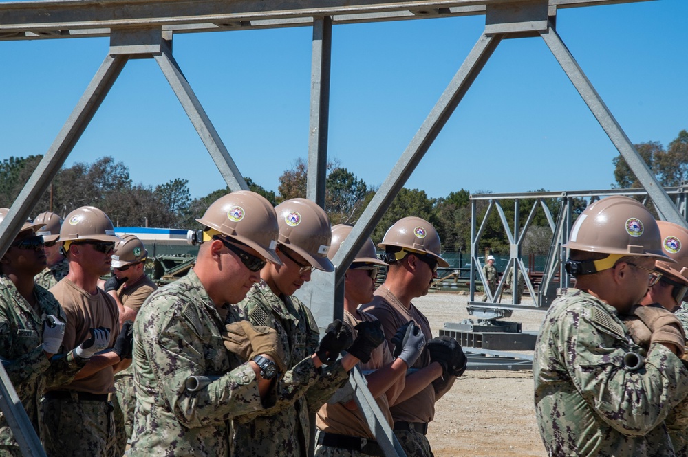 US Navy Seabees with Naval Mobile Construction Battalion 5 build a Mabey Johnson Bridge