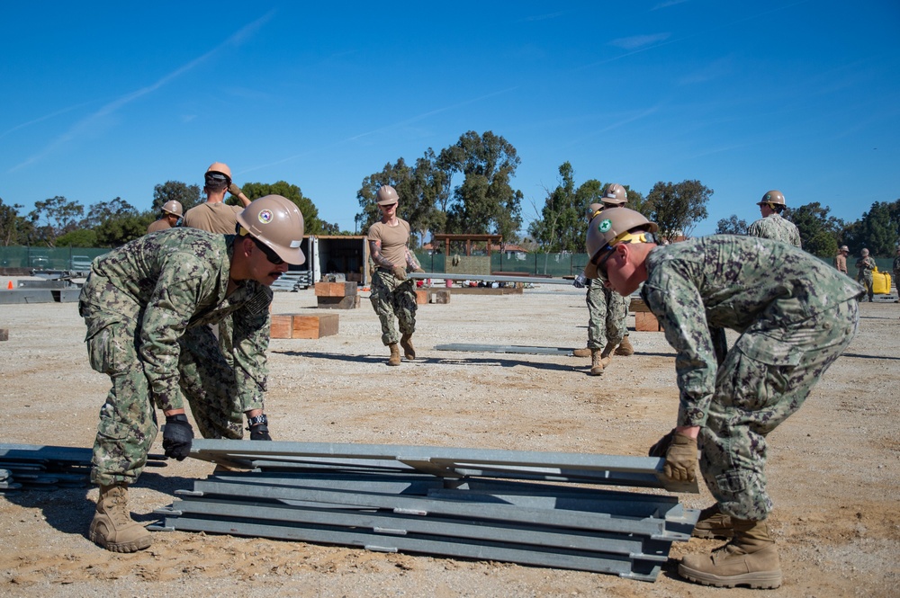 US Navy Seabees with Naval Mobile Construction Battalion 5 build a Mabey Johnson Bridge