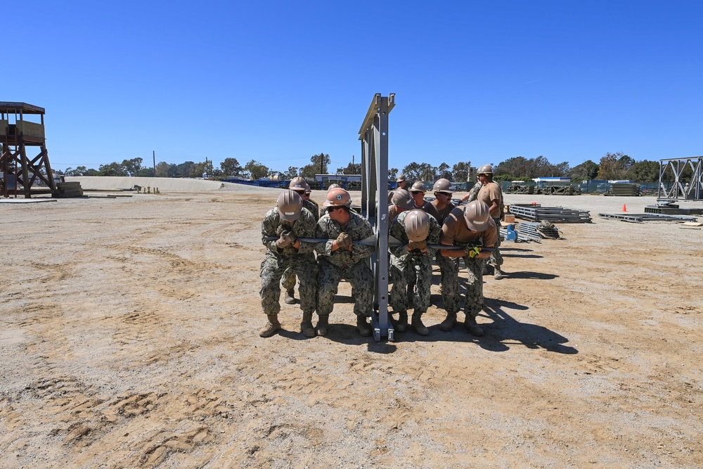 US Navy Seabees with Naval Mobile Construction Battalion 5 build a Mabey Johnson Bridge