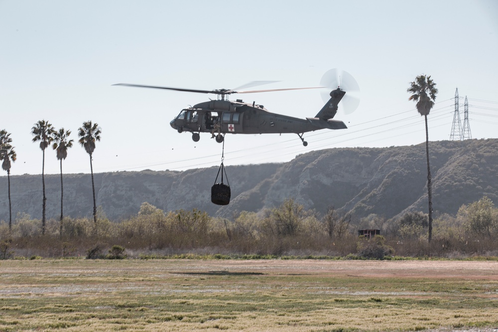 U.S. Marines and Soldiers with 1st Landing Support Battalion and 7-158th Ground Support Aviation Battalion conduct HST training