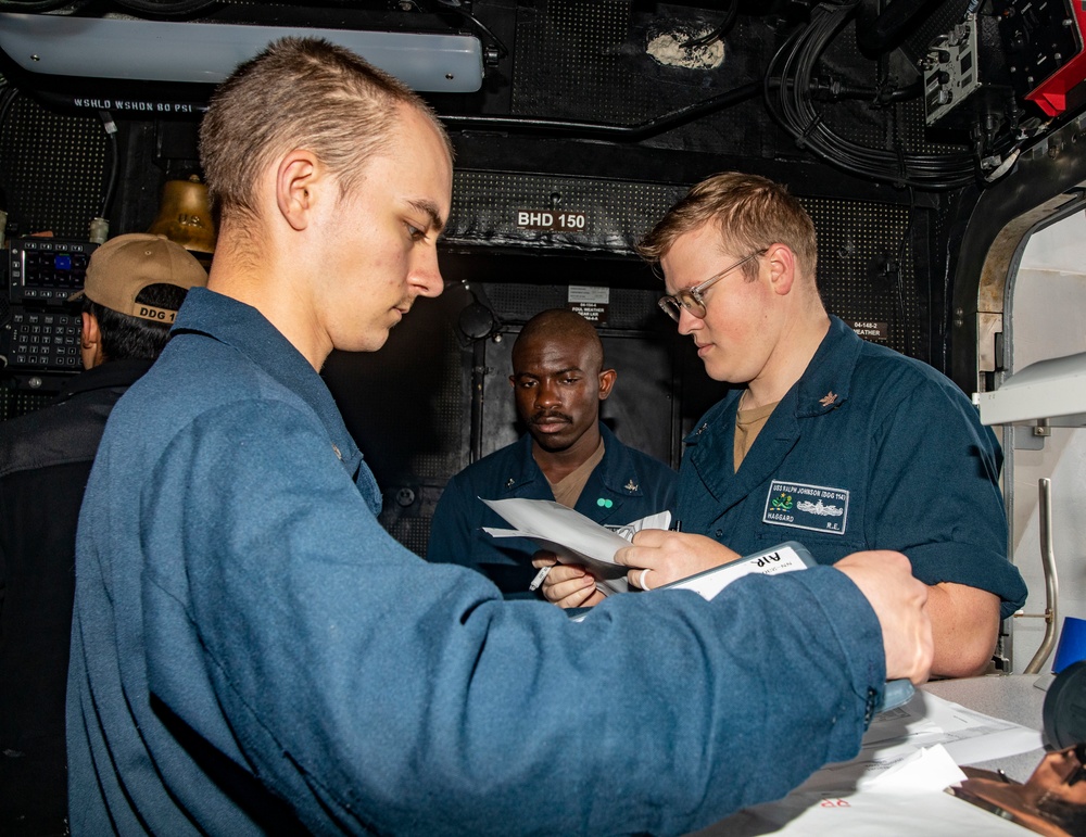Sailors Aboard USS Ralph Johnson (DDG 114) Conduct Man Overboard Drill