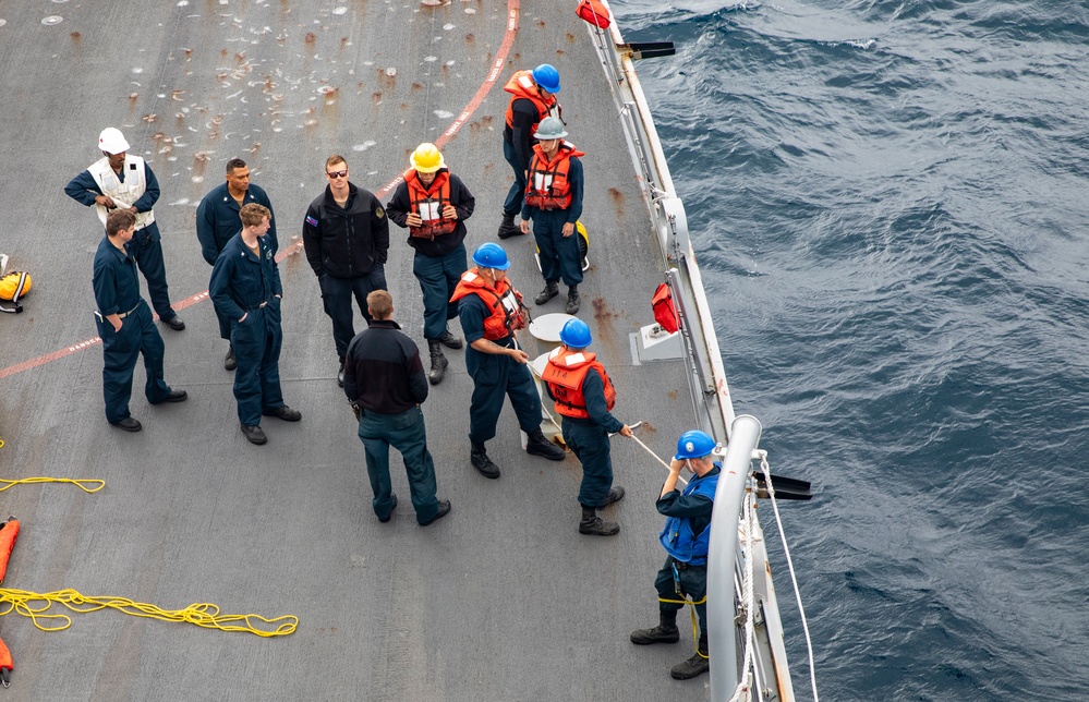Sailors Aboard USS Ralph Johnson (DDG 114) Conduct Man Overboard Drill