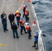 Sailors Aboard USS Ralph Johnson (DDG 114) Conduct Man Overboard Drill