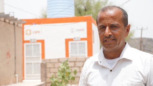 Doctor Stands in front of USAID-Funded Health Facility in Yemen