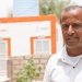 Doctor Stands in front of USAID-Funded Health Facility in Yemen