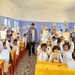 Students in Yemen Hold Up Learning Materials Developed with USAID Funding