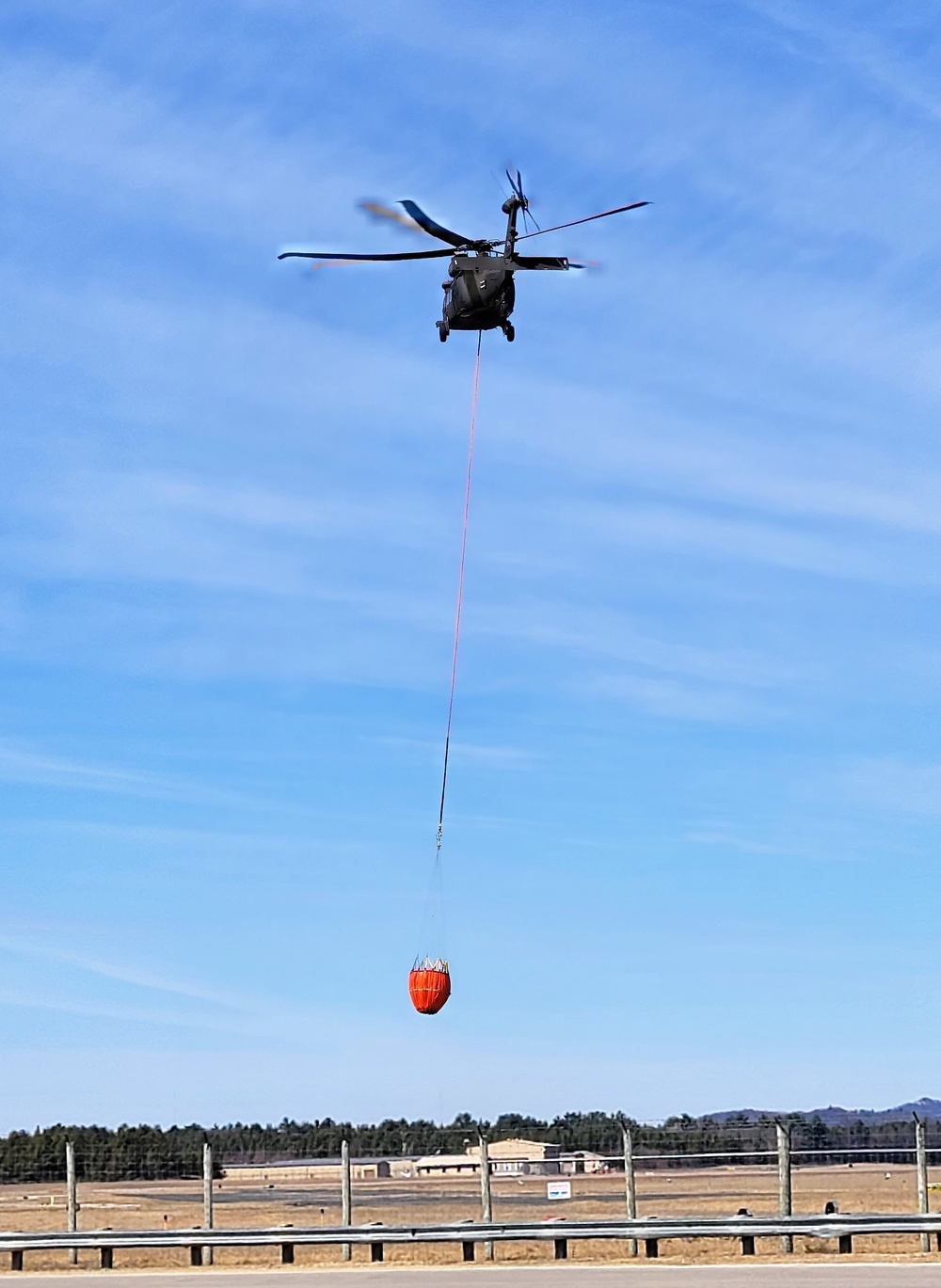 Federal, state agencies partner for fire-suppression training with UH-60 Black Hawks at Fort McCoy