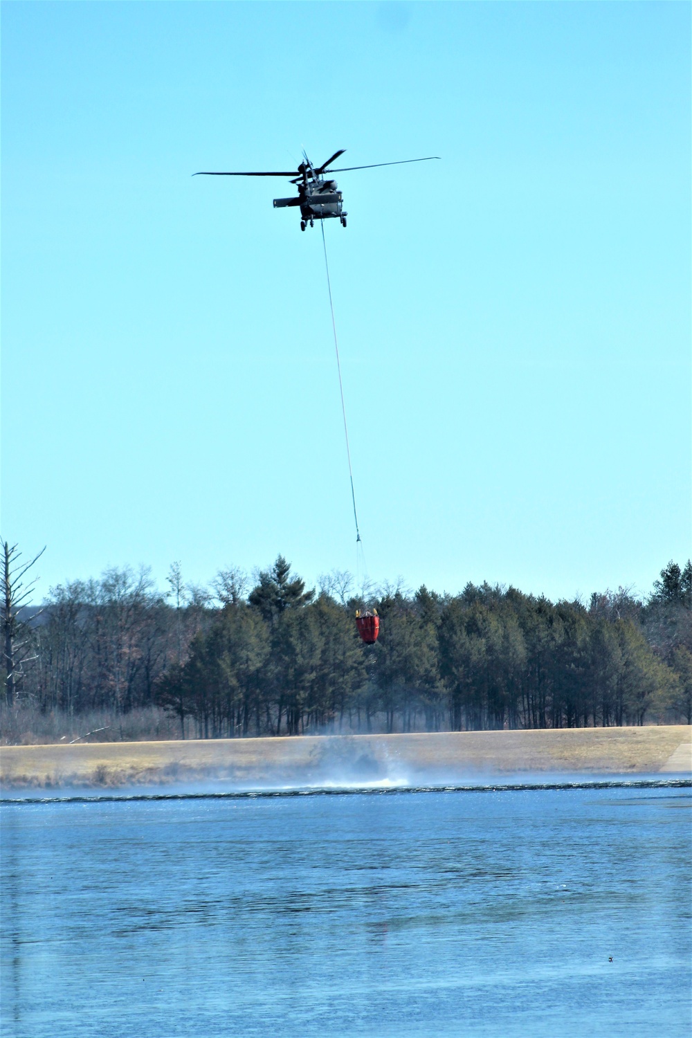 Federal, state agencies partner for fire-suppression training with UH-60 Black Hawks at Fort McCoy