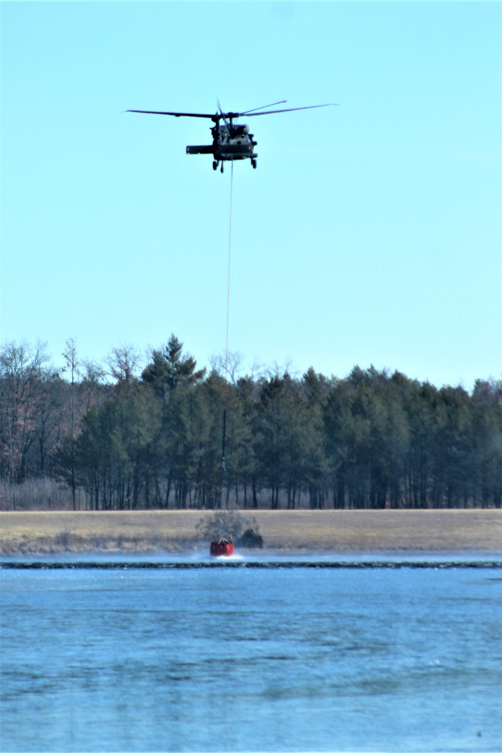 Federal, state agencies partner for fire-suppression training with UH-60 Black Hawks at Fort McCoy