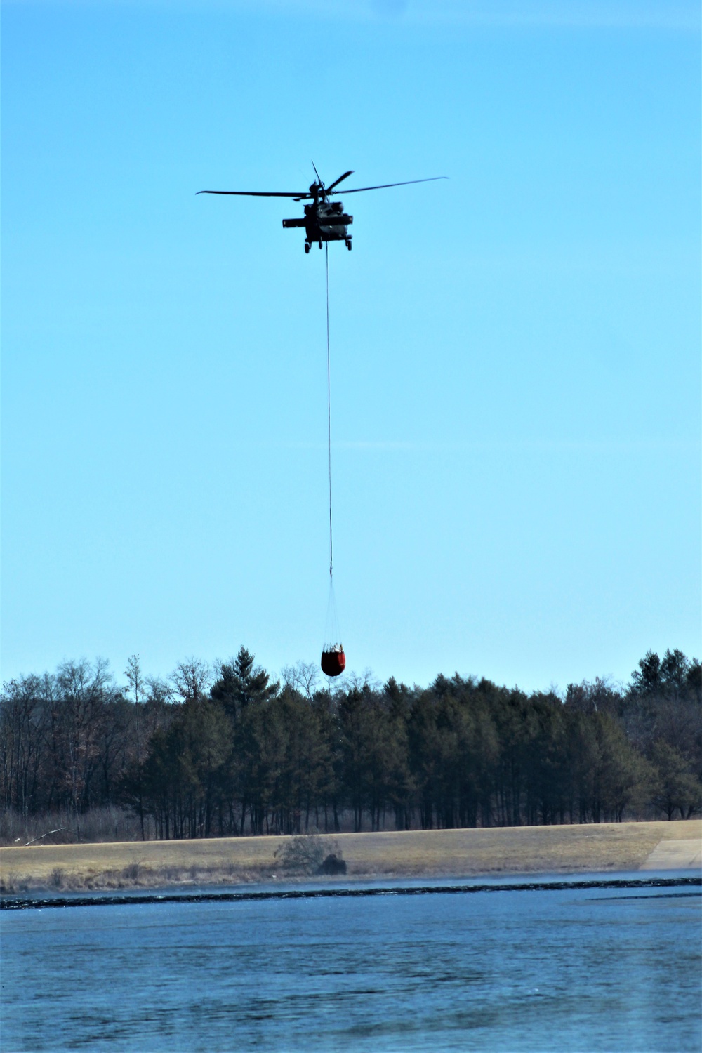 Wisconsin Army National Guard UH-60 Black Hawk crew holds Bambi bucket training at Fort McCoy