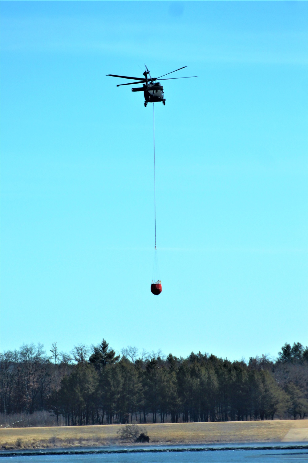 Wisconsin Army National Guard UH-60 Black Hawk crew holds Bambi bucket training at Fort McCoy