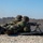 A Marine reloads the 7.62 FN MAG for his fellow enlisted A Marine reloads the 7.62 FN MAG for his fellow enlisted