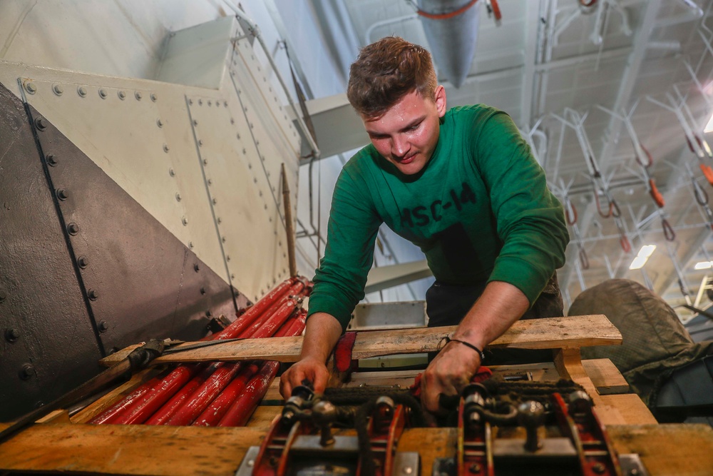 Abraham Lincoln Sailors conduct aircraft maintenance