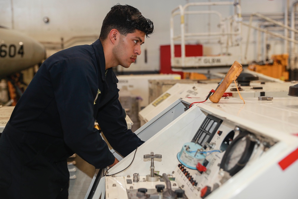 Abraham Lincoln Sailors conduct aircraft maintenance